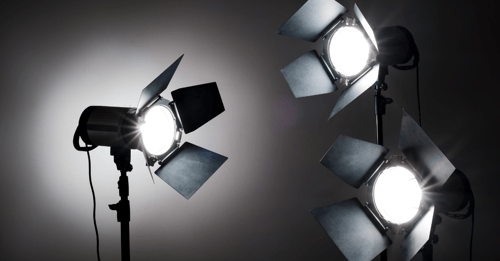 Photography lighting equipment . 3 lights facing into the centre of the image.